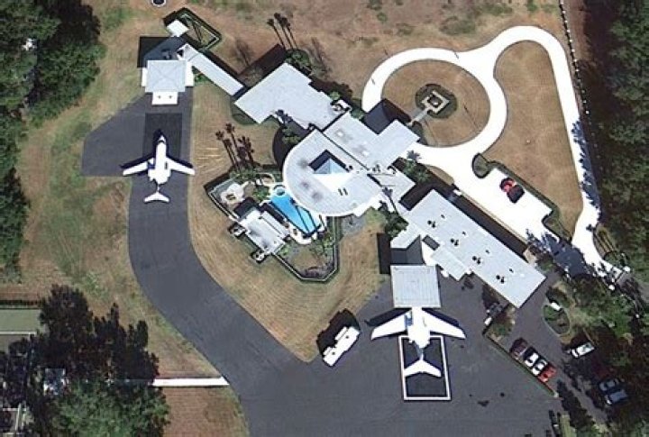 Does John Travolta have a landing strip at his house?